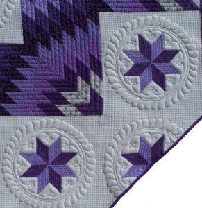 passionately purple detail of quilting lone star quilt