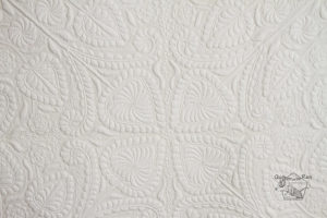 flowers and feathers detail whole cloth quilt